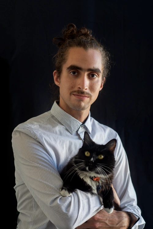 Artist portrait holding his beloved cat Dave